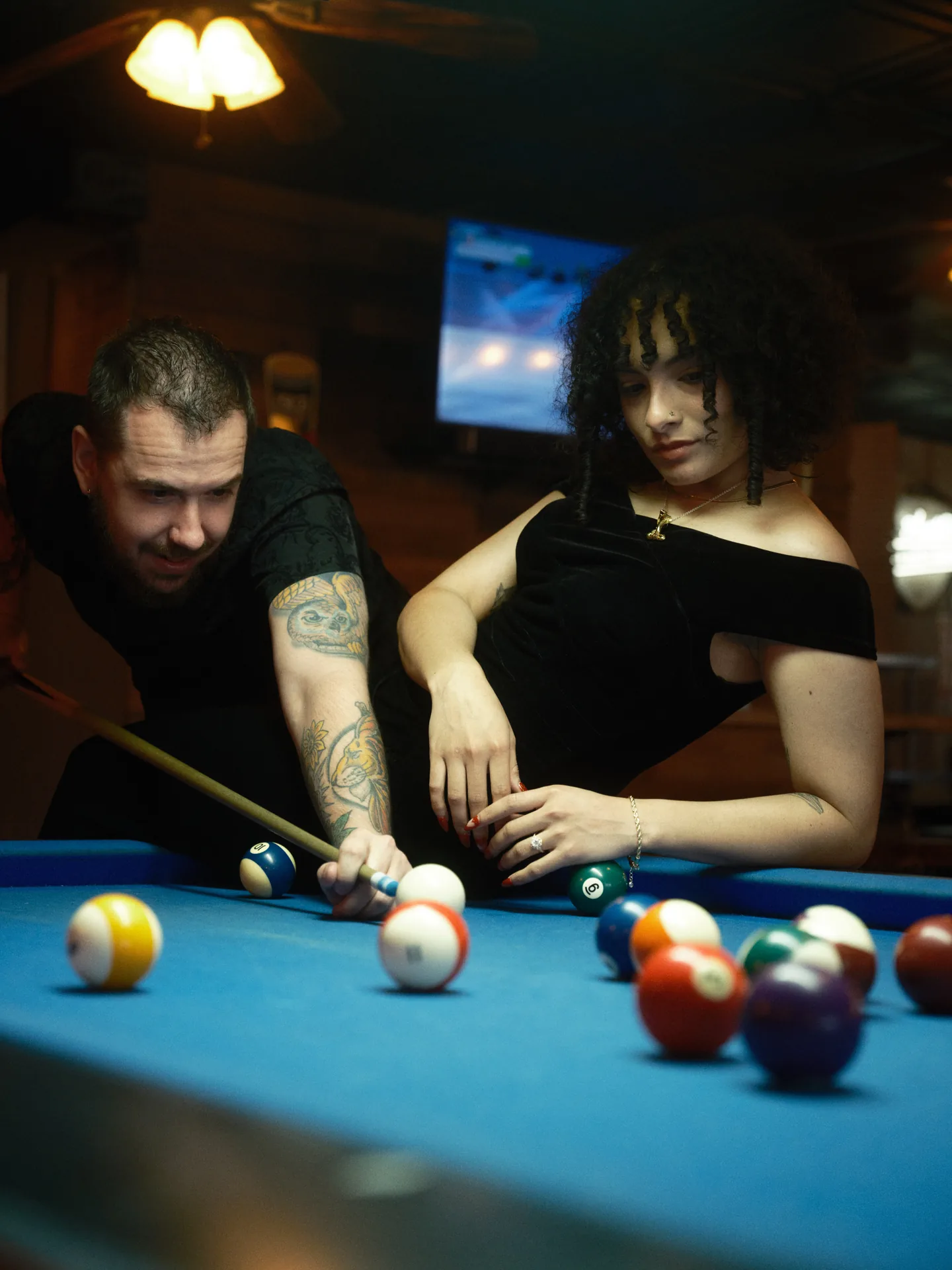 Couple playing pool